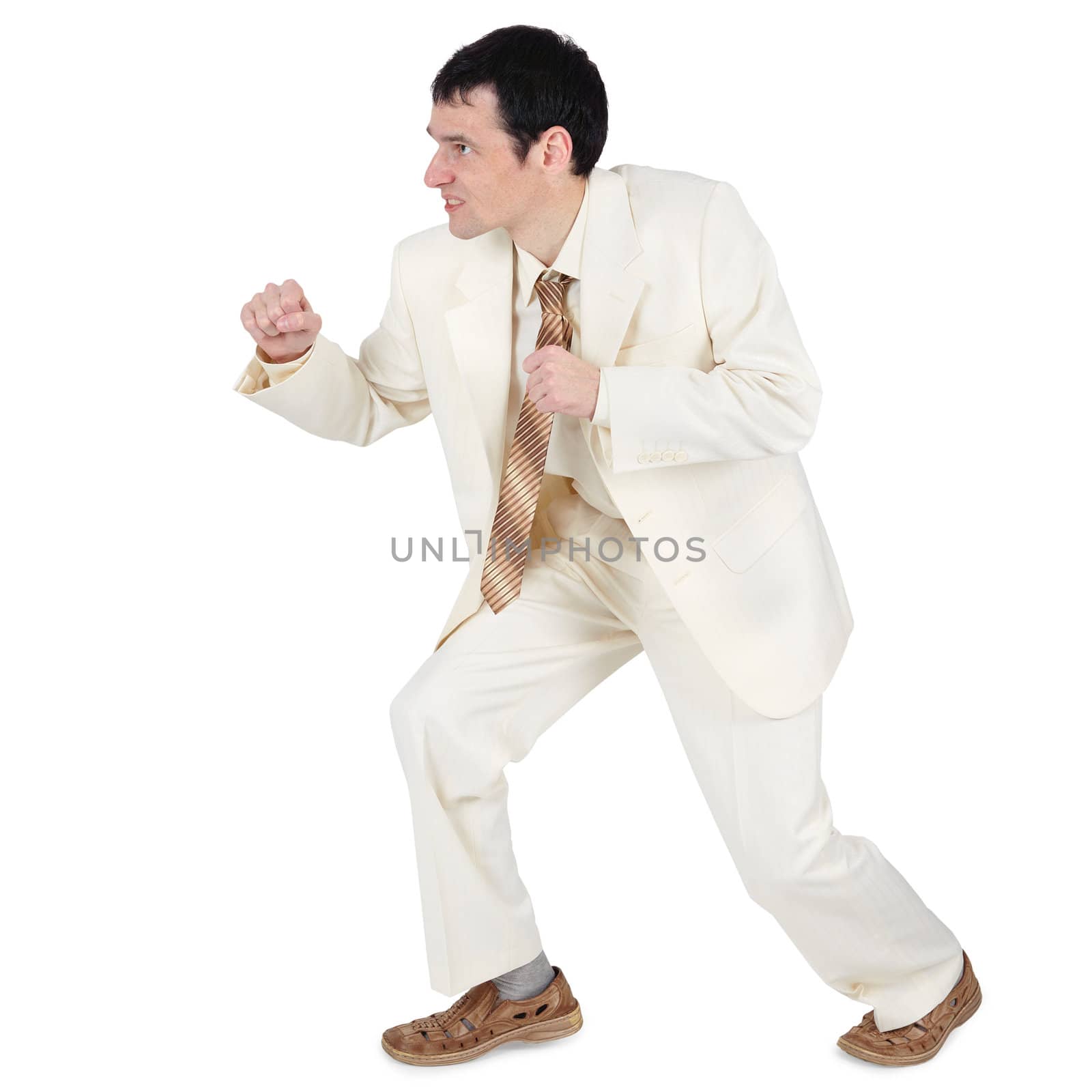 An aggressive businessman, willing to attack, isolated on a white background
