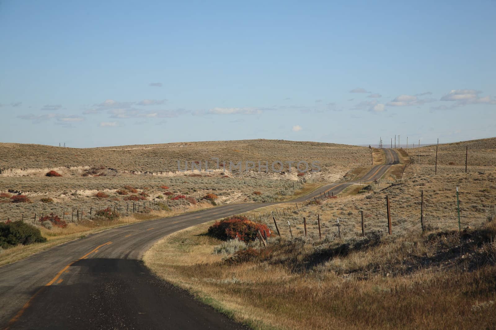 Isolated winding road in American Great Plains