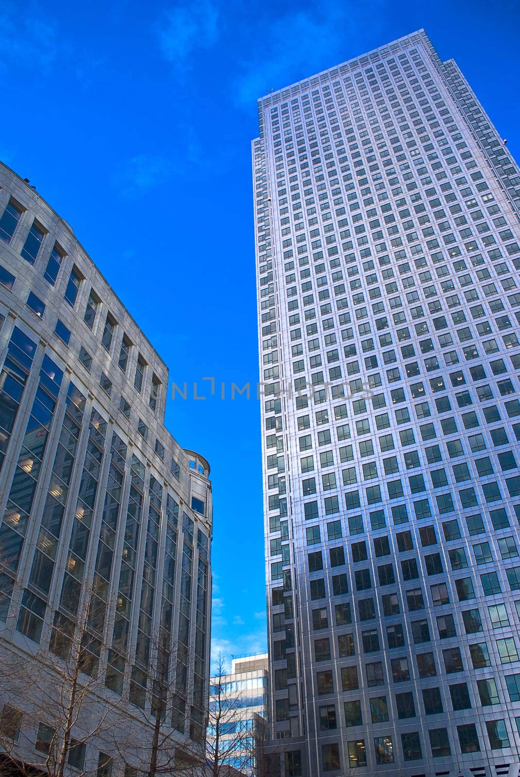 Skyscrapers against blue sky with clouds