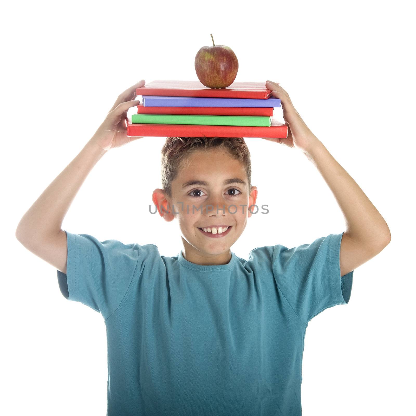 a happy boy with books and an apple on his head