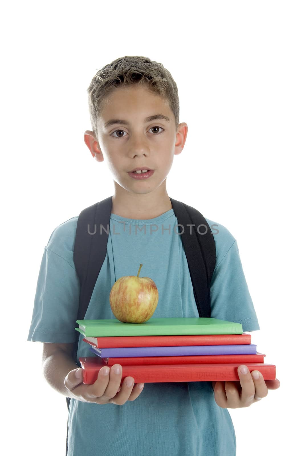 a boy with a pile of books and a healthy apple
