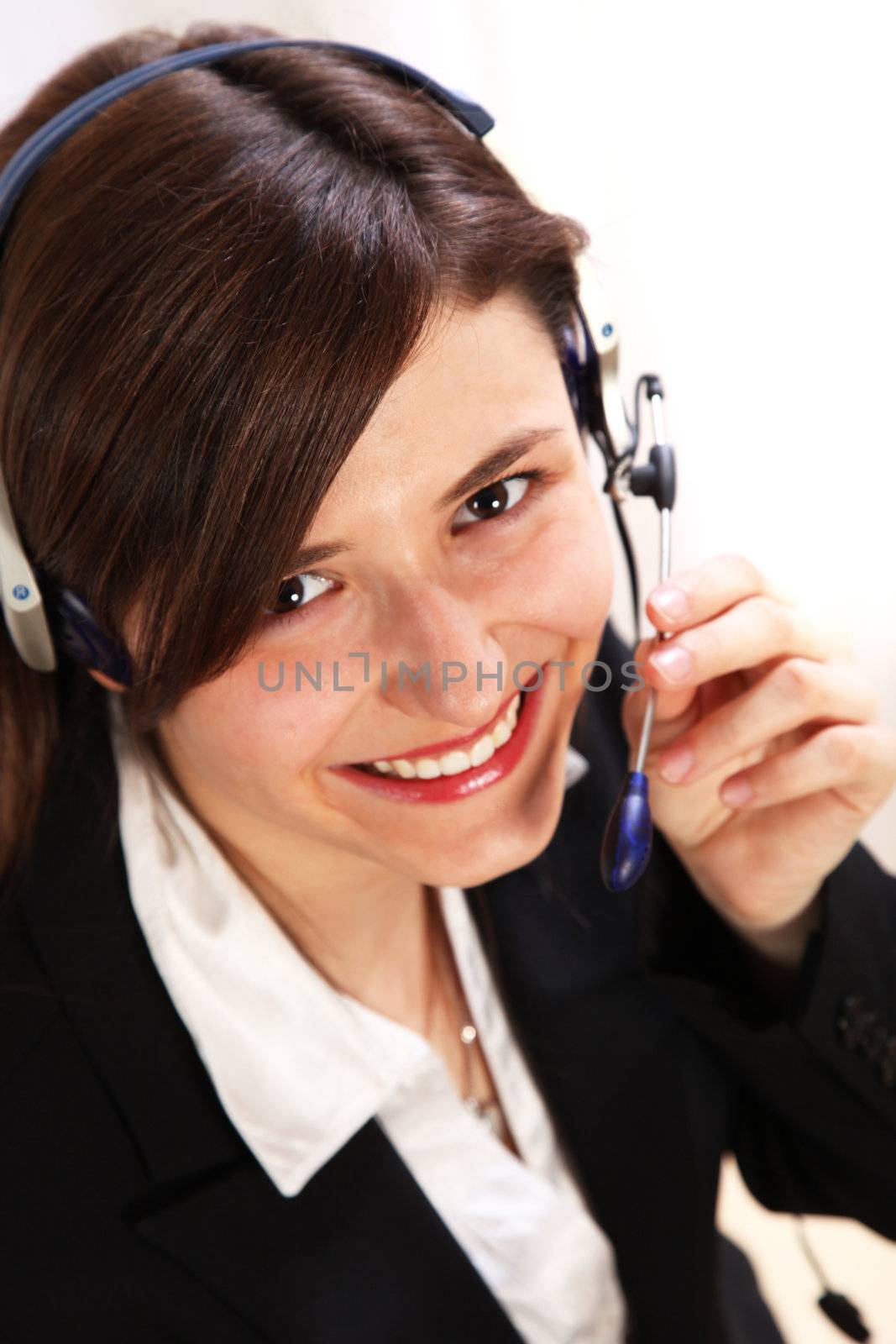 Smiling telephone operator - close-up