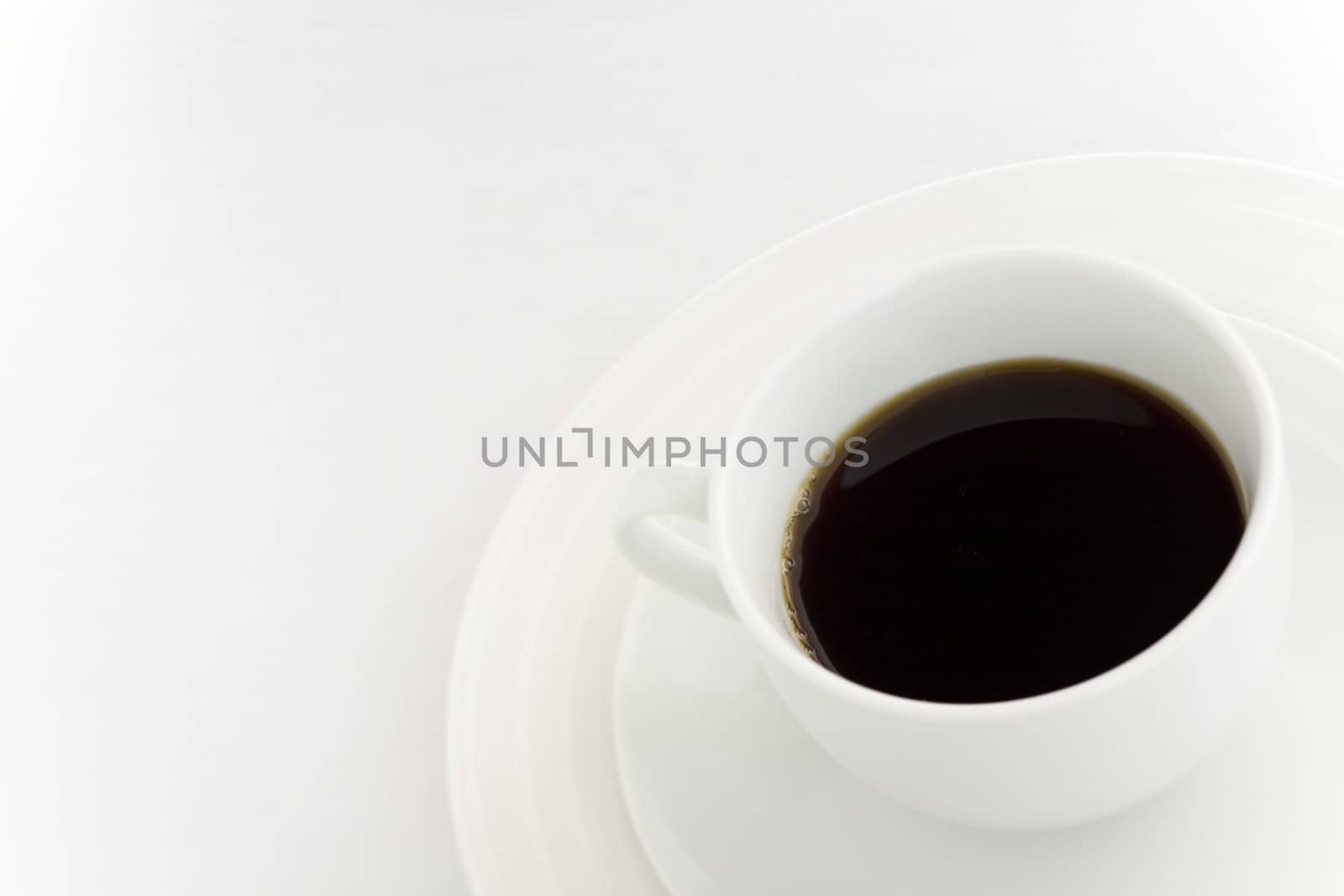 White coffee cup over a white background