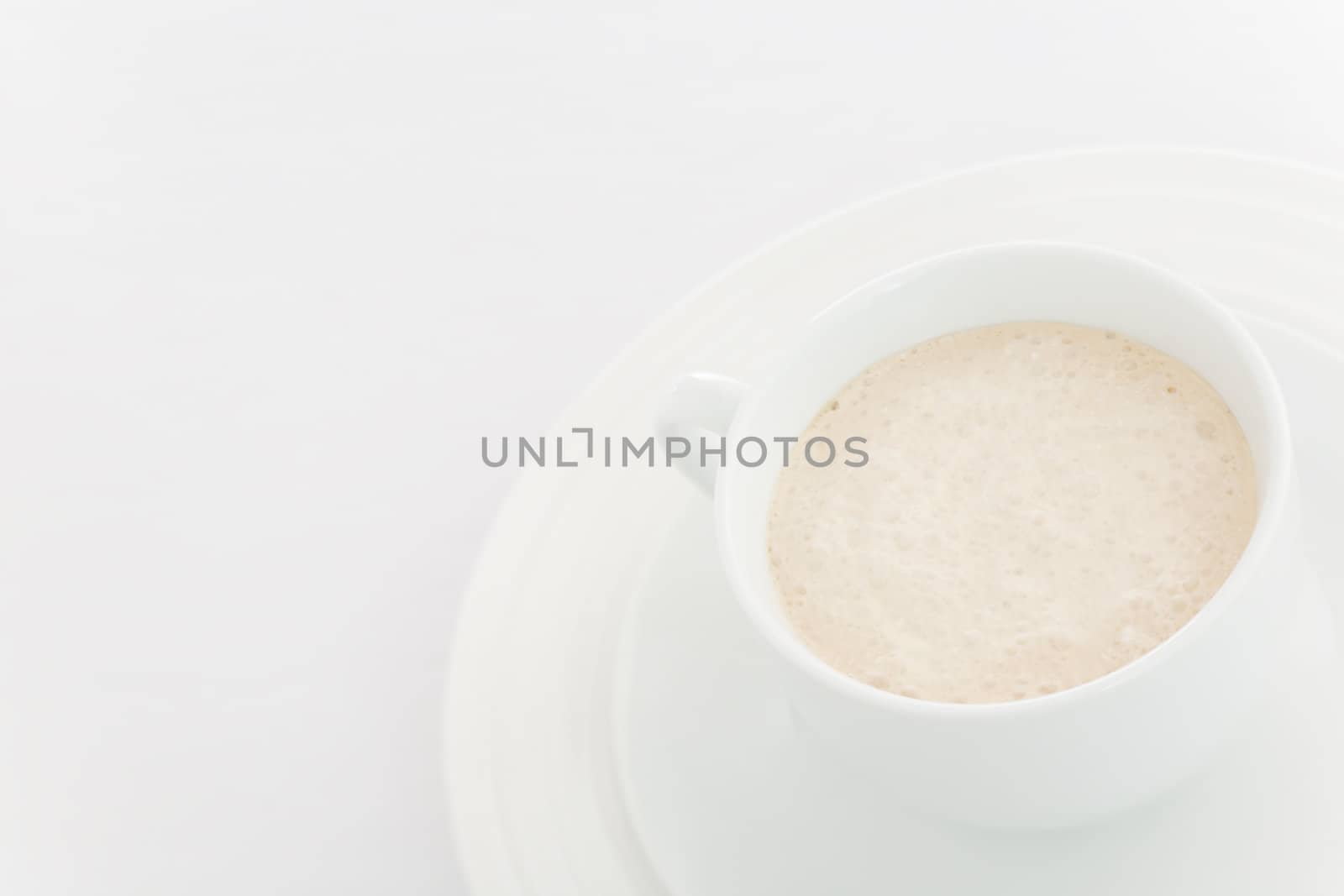 White coffee  (latte) cup over a white background