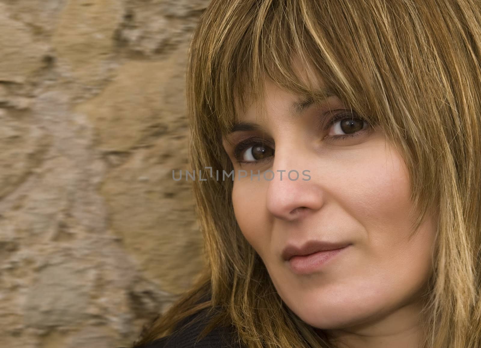 Colour portrait of a woman looking straight at the camera