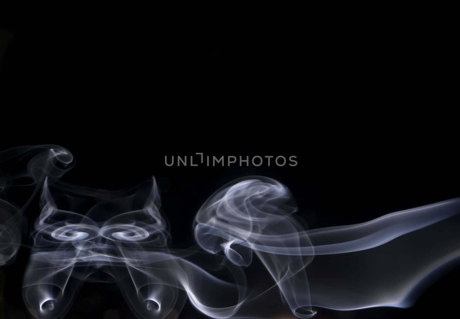 Abstract image of smoke trails frozen with off camera flash