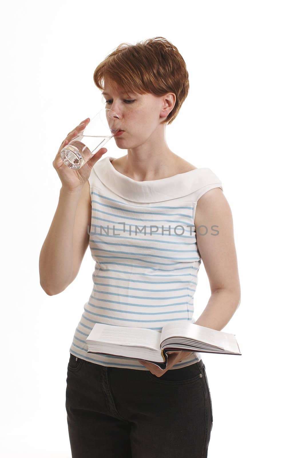 Girl holding the book and drinking water