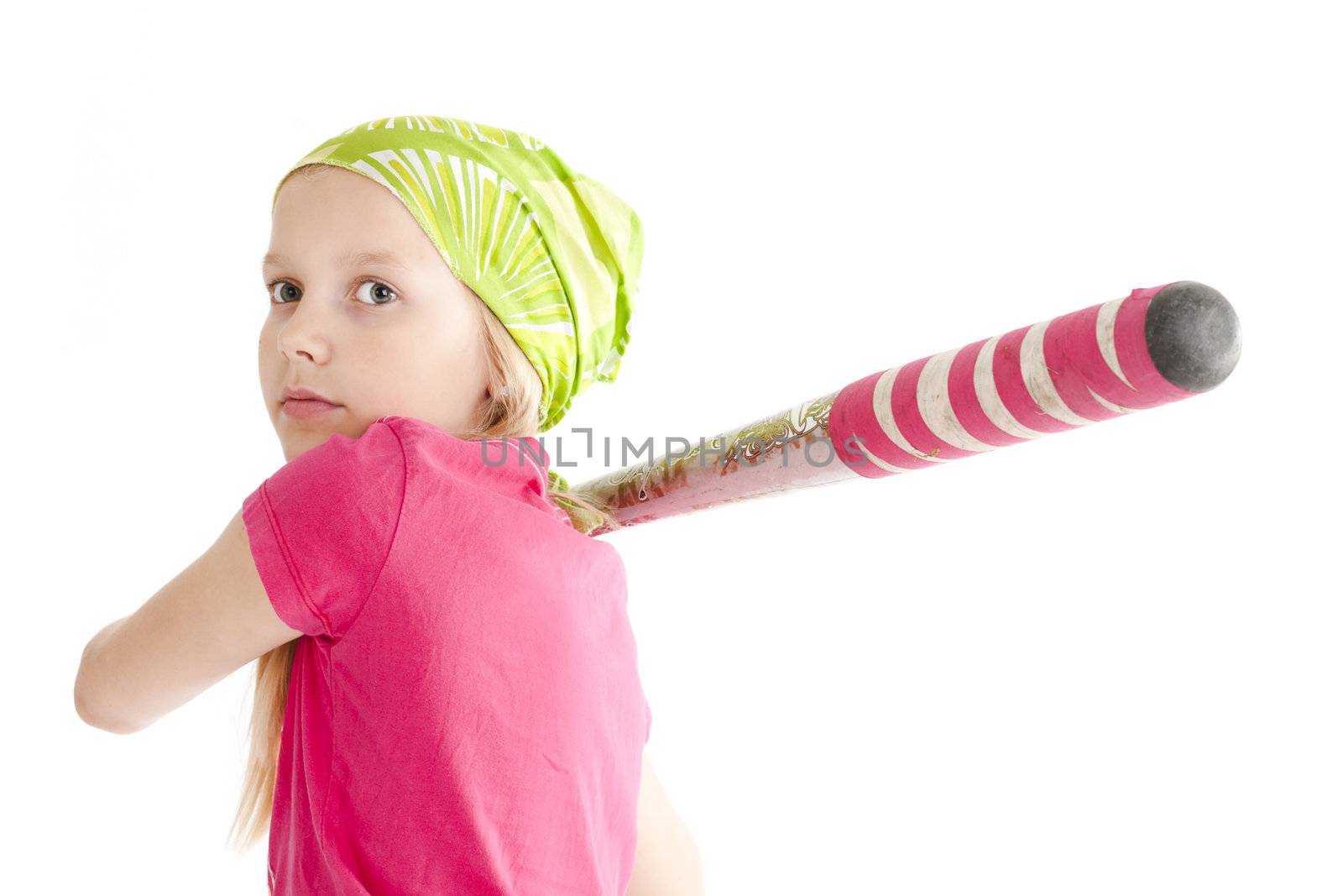 Young softball player hitting the ball with bat