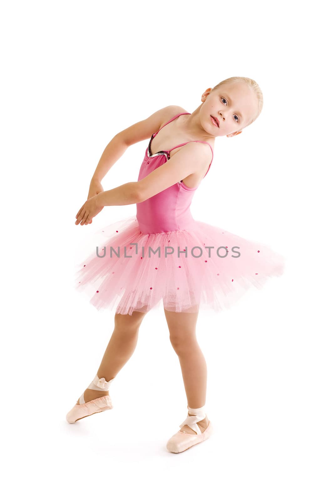 Young ballerina dancer over a white background