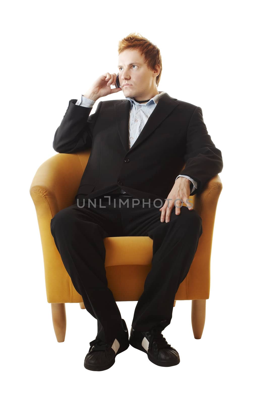 businessman on the couch with mobile phone