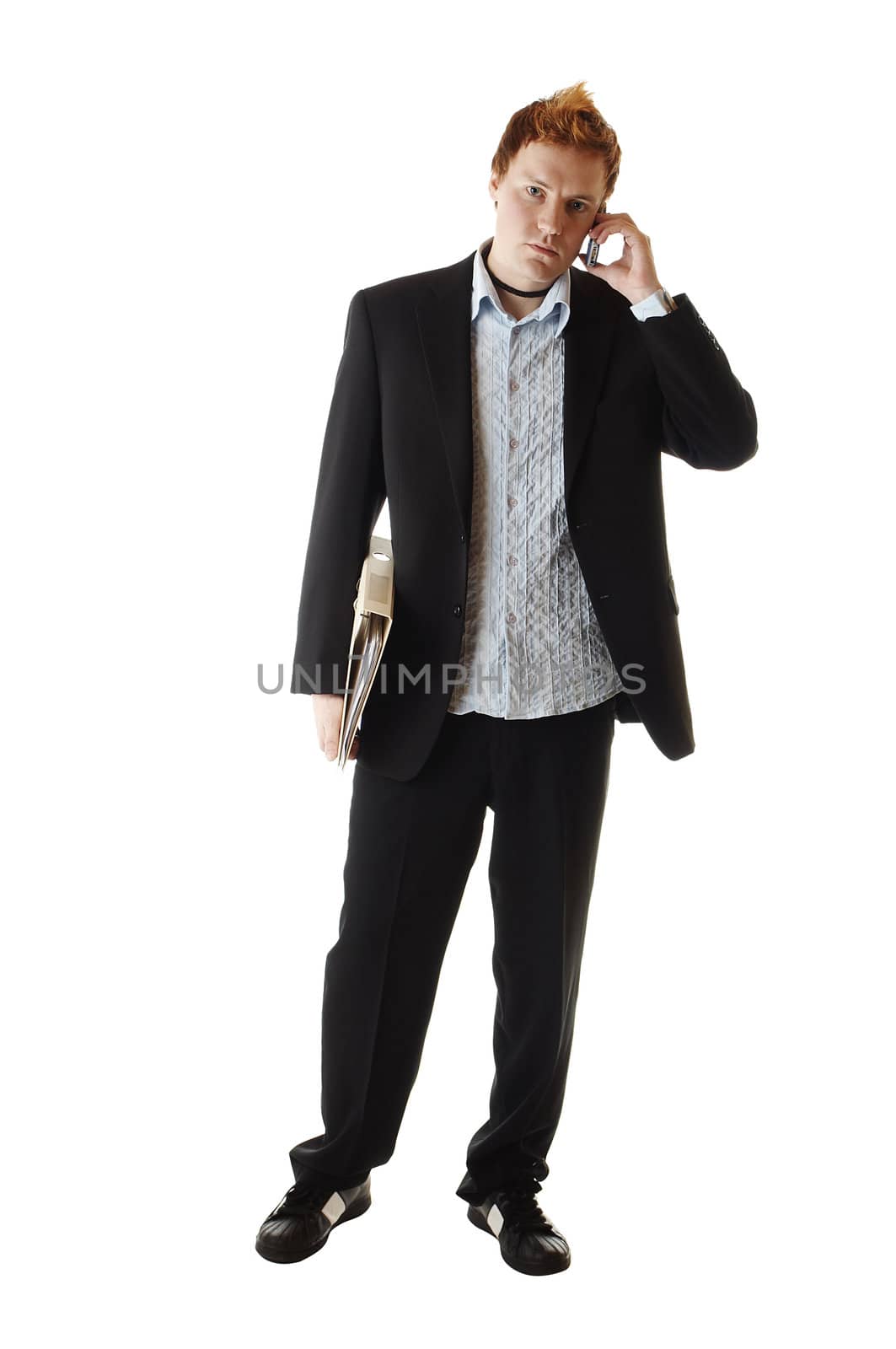 Business man holding a book and talking on a phone