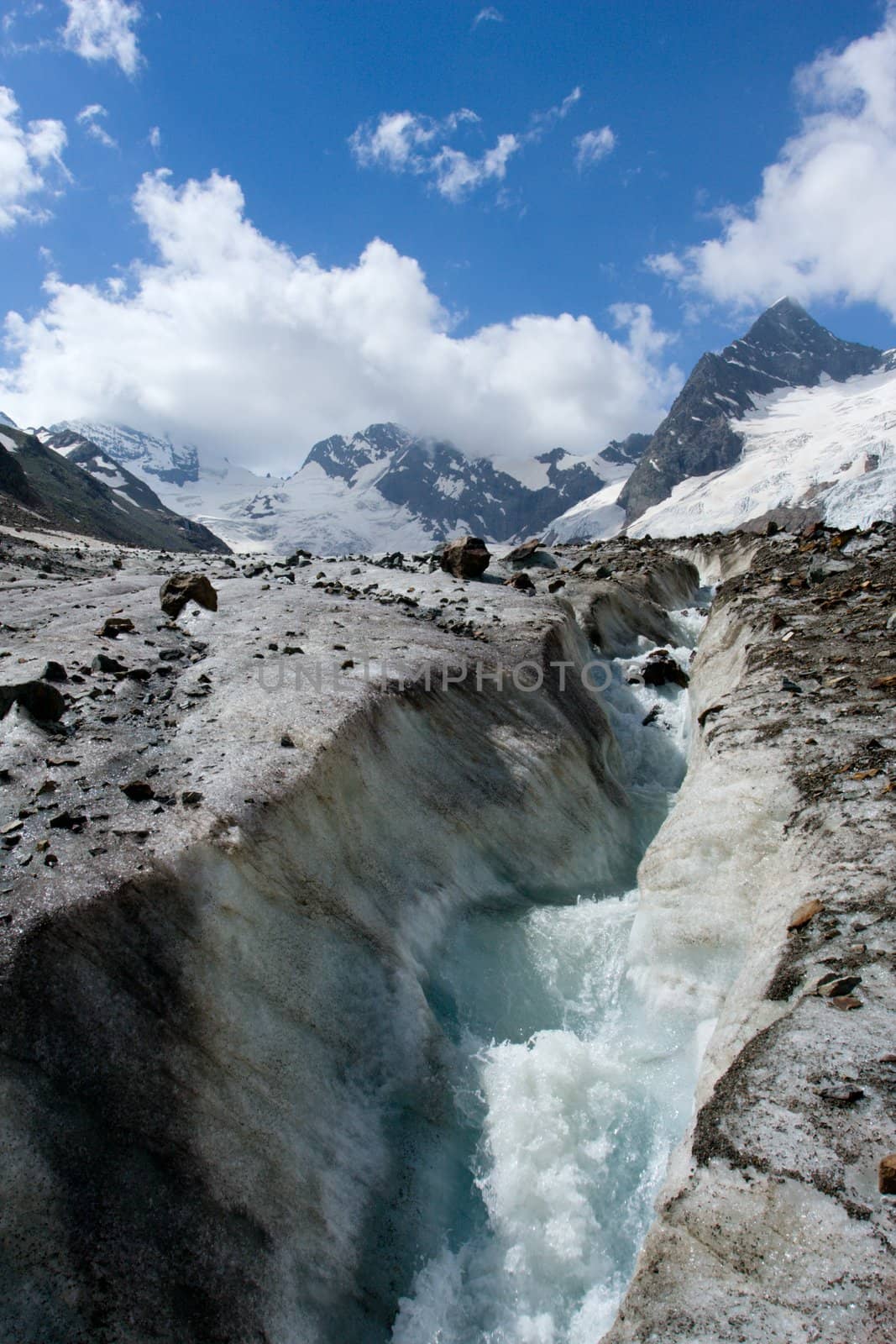 River on glacier in Caucasus mountains