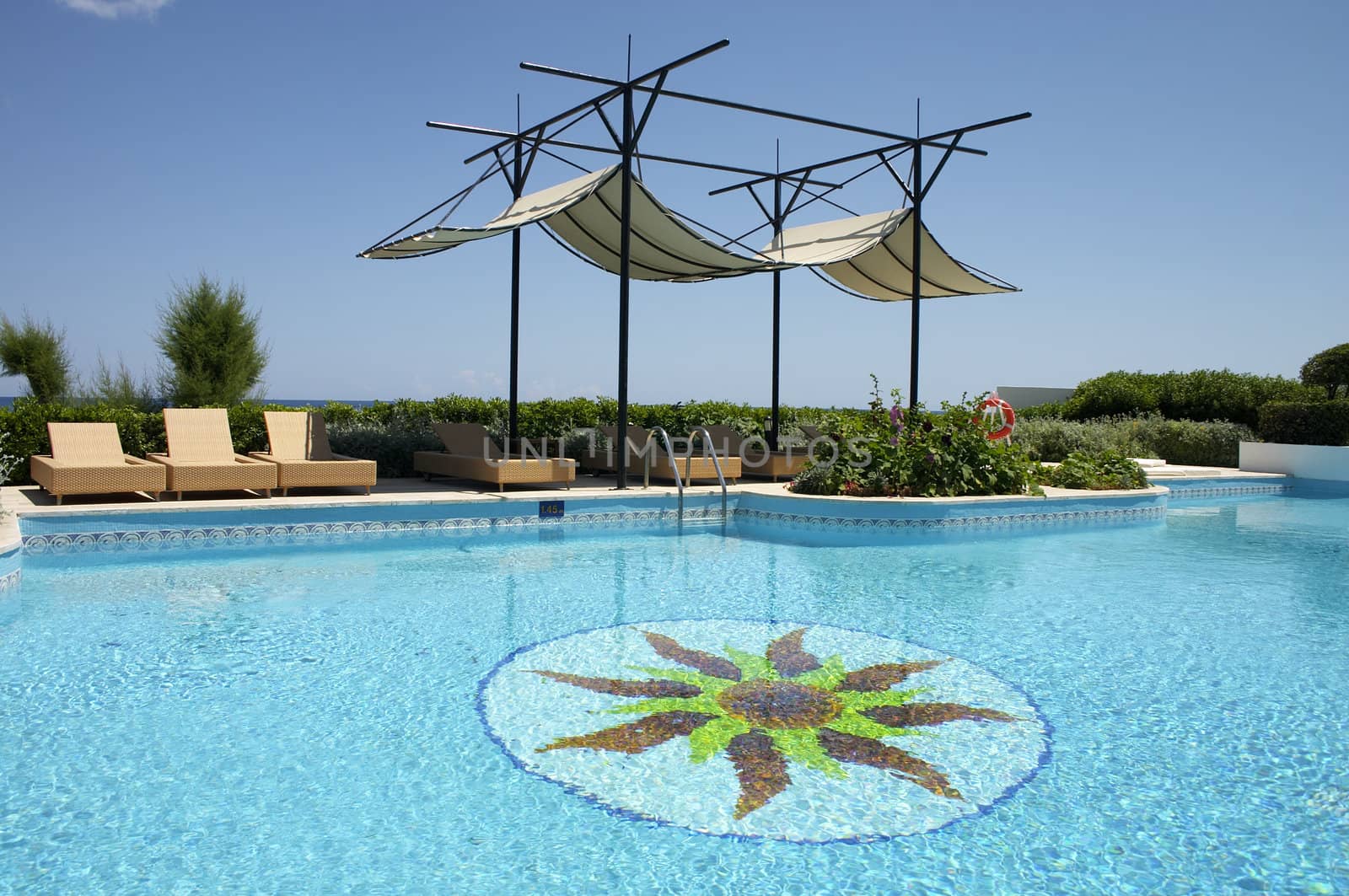 swimming pool and sunshade in resort