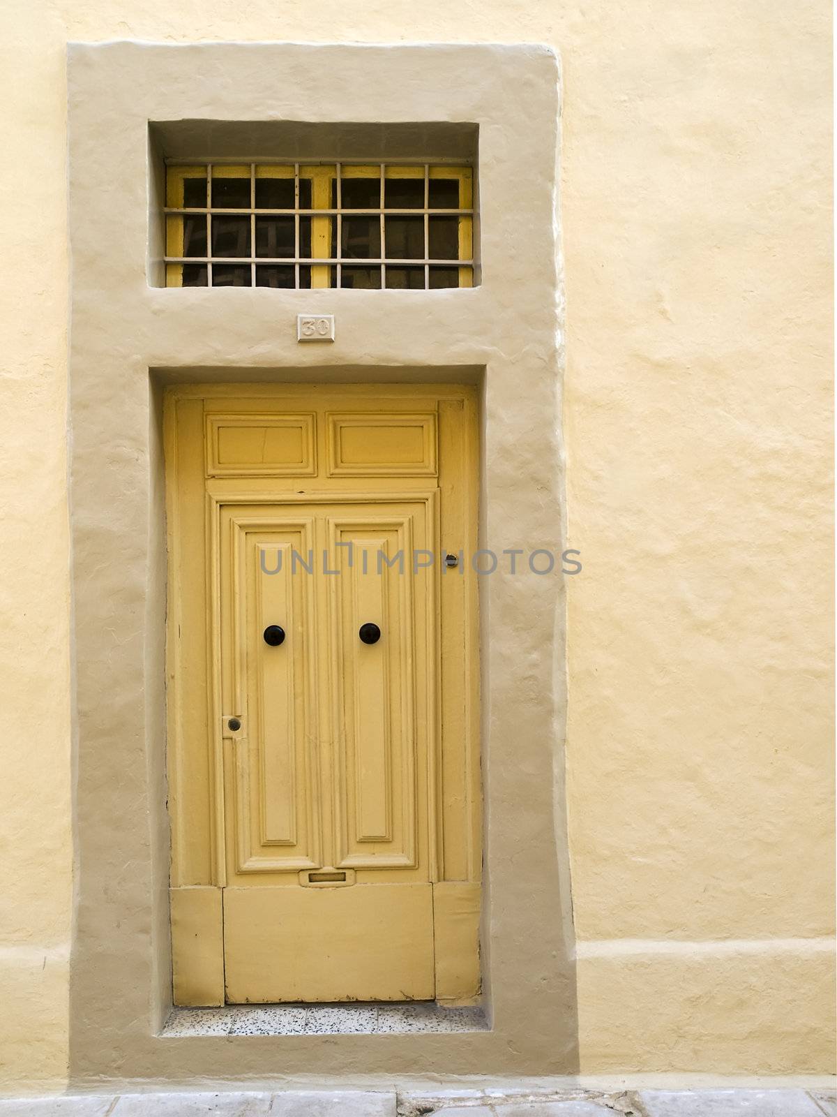 A weird single panel door in Mdina fabricated in such a way as to resemble the traditional double pane Malta door