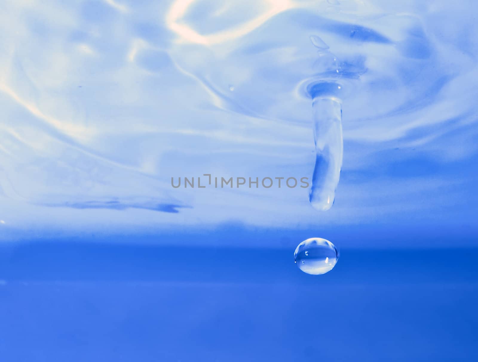 Water droplet frozen in action by off camera flash