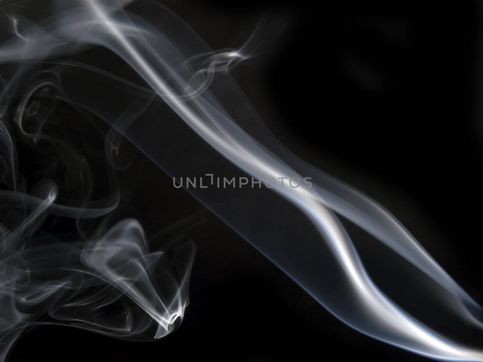 Abstract image of smoke trails frozen with off camera flash