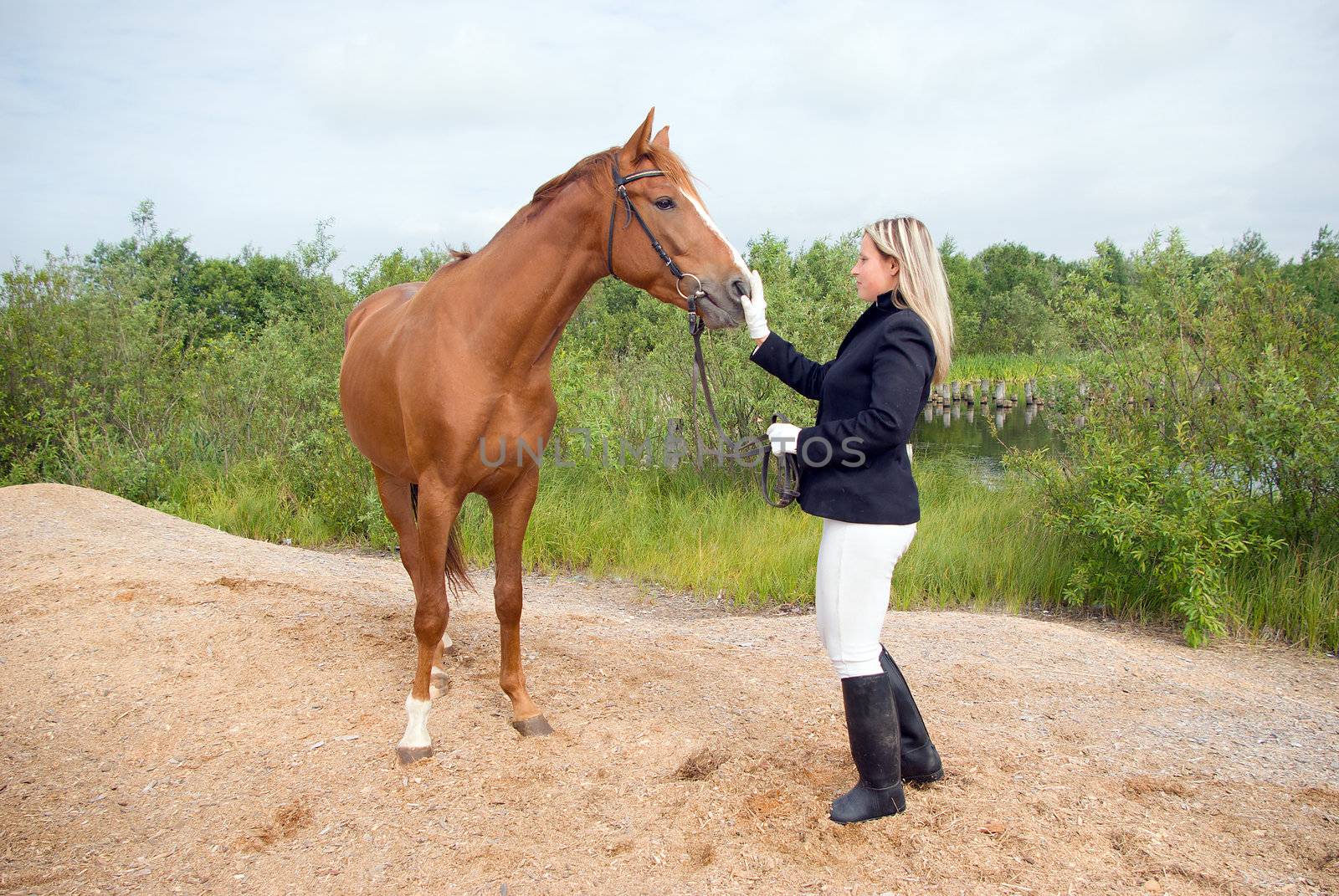 Girl -a jockey and horse.Contact with nature