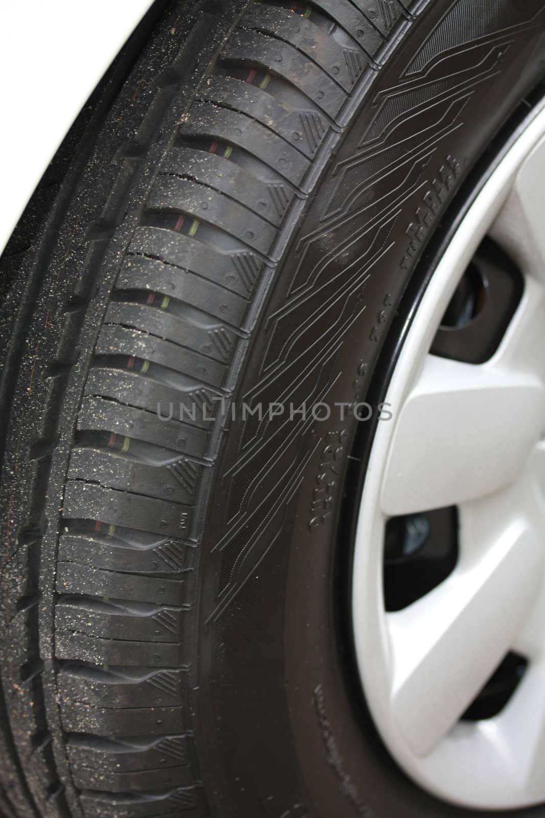 new car tire detail by studioportosabbia