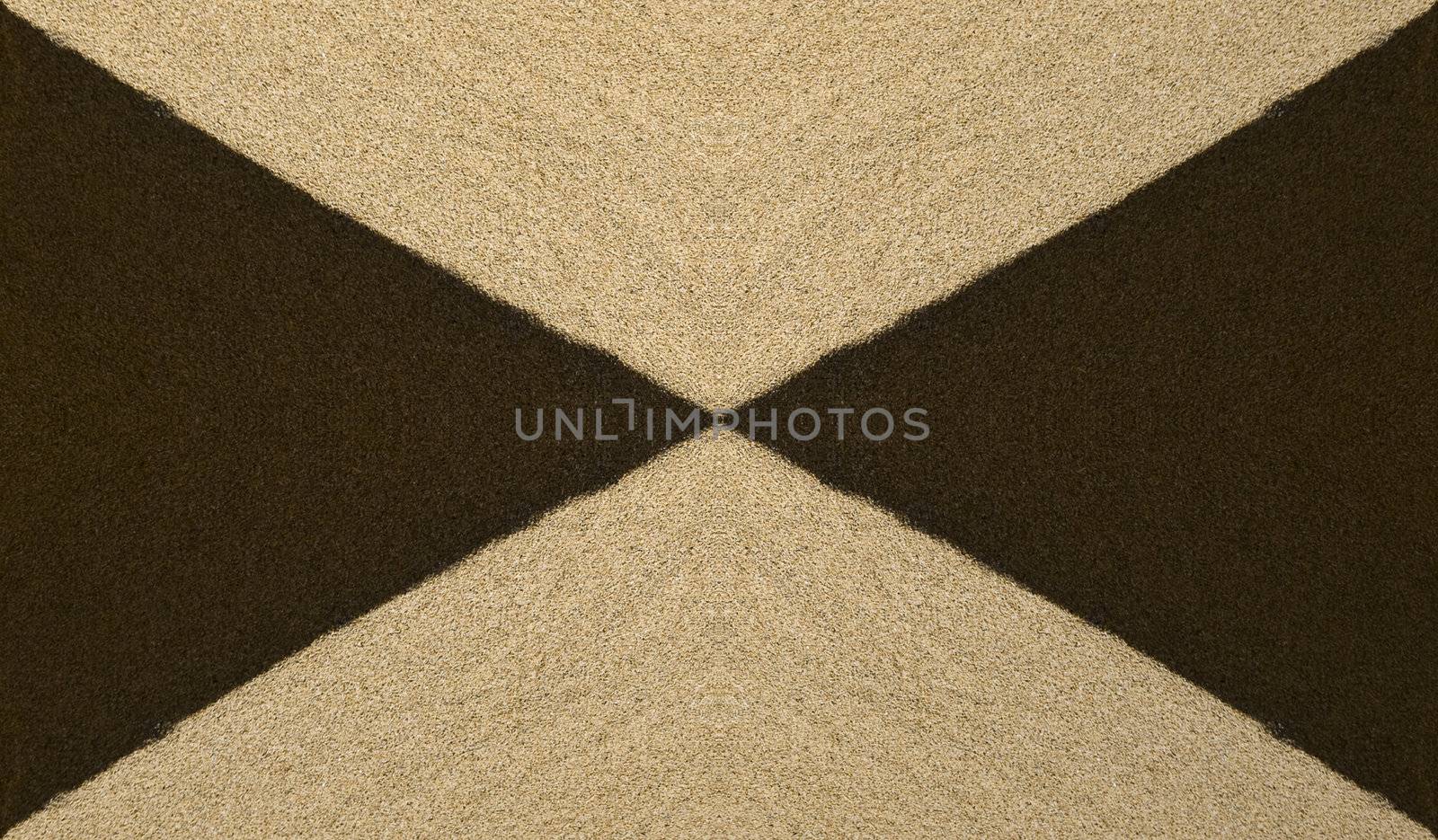 Abstract image showing detail of sand dunes in light and shadow at Golden Bay in Malta