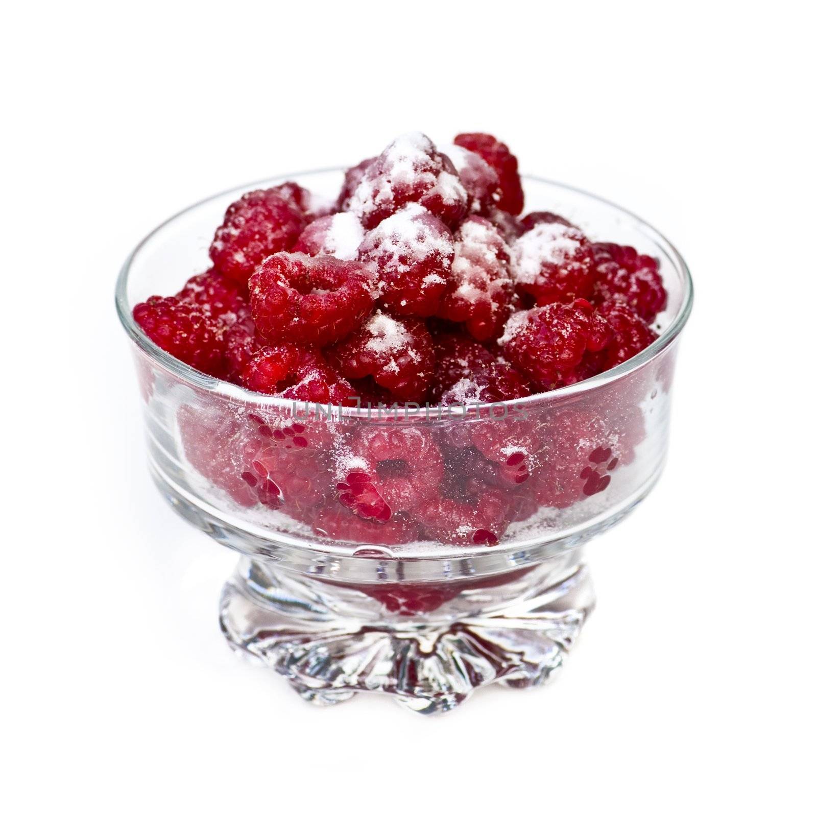 Fresh raspberries in dish by elenathewise