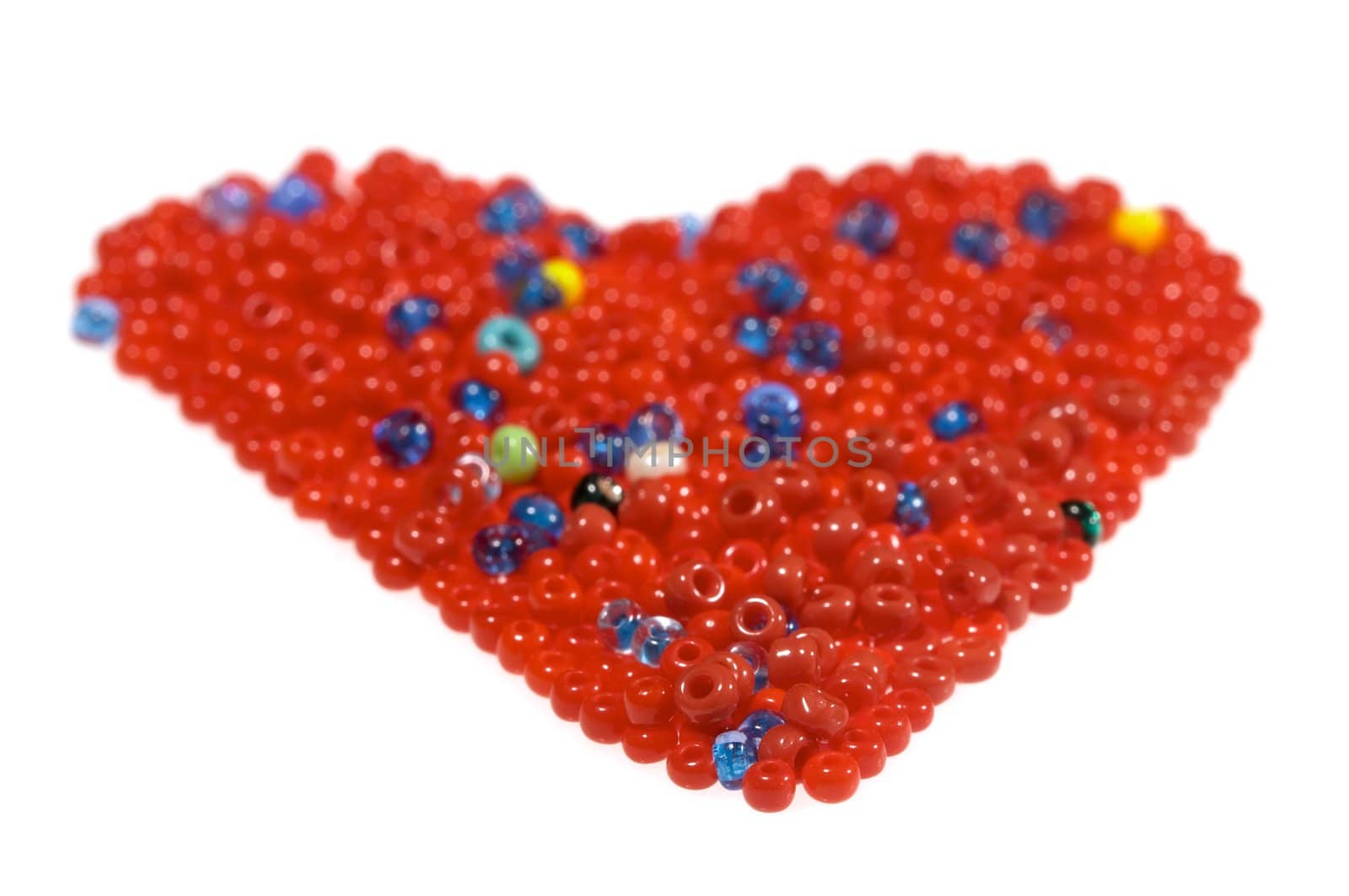 Heart made of glass beads, isolated on white