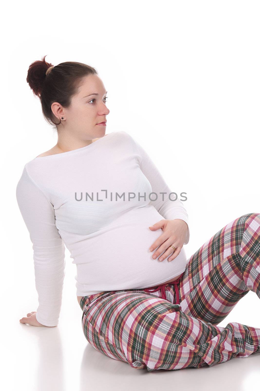 pregnant woman holding belly on white background