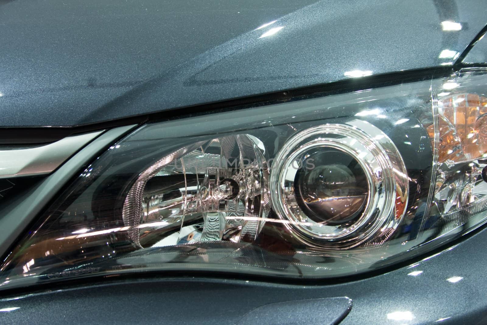 Close-up of a grey modern car head lamp