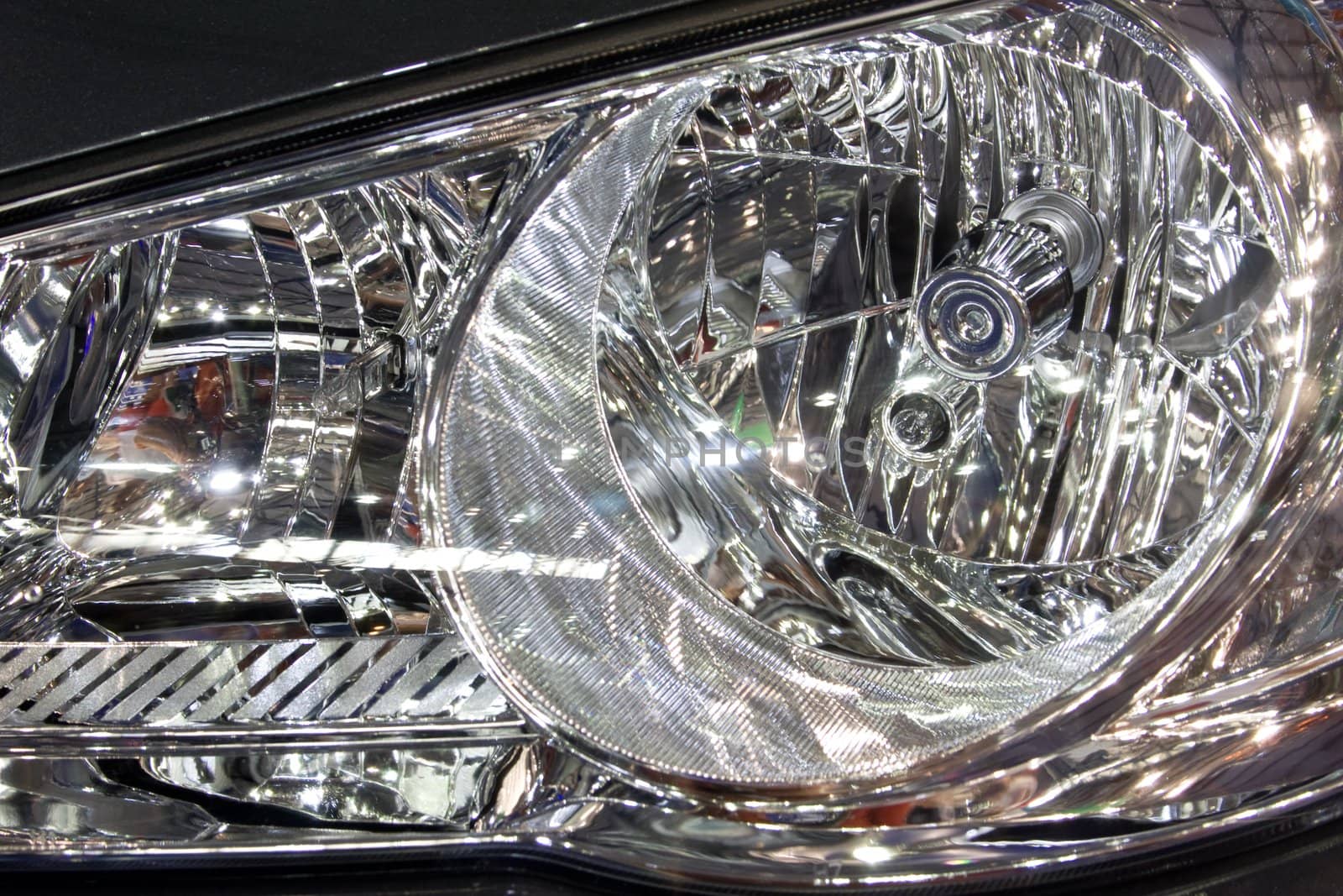Close-up of a new modern car head lamp