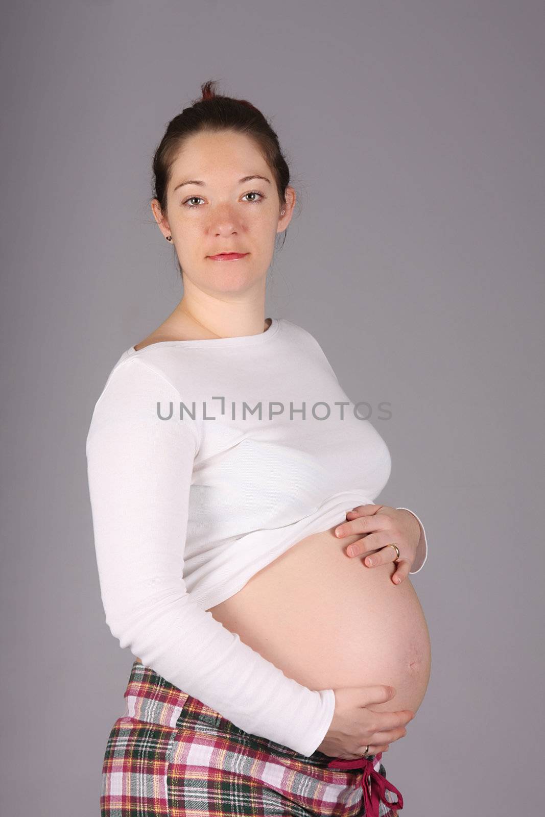 pregnant woman holding belly by vladacanon