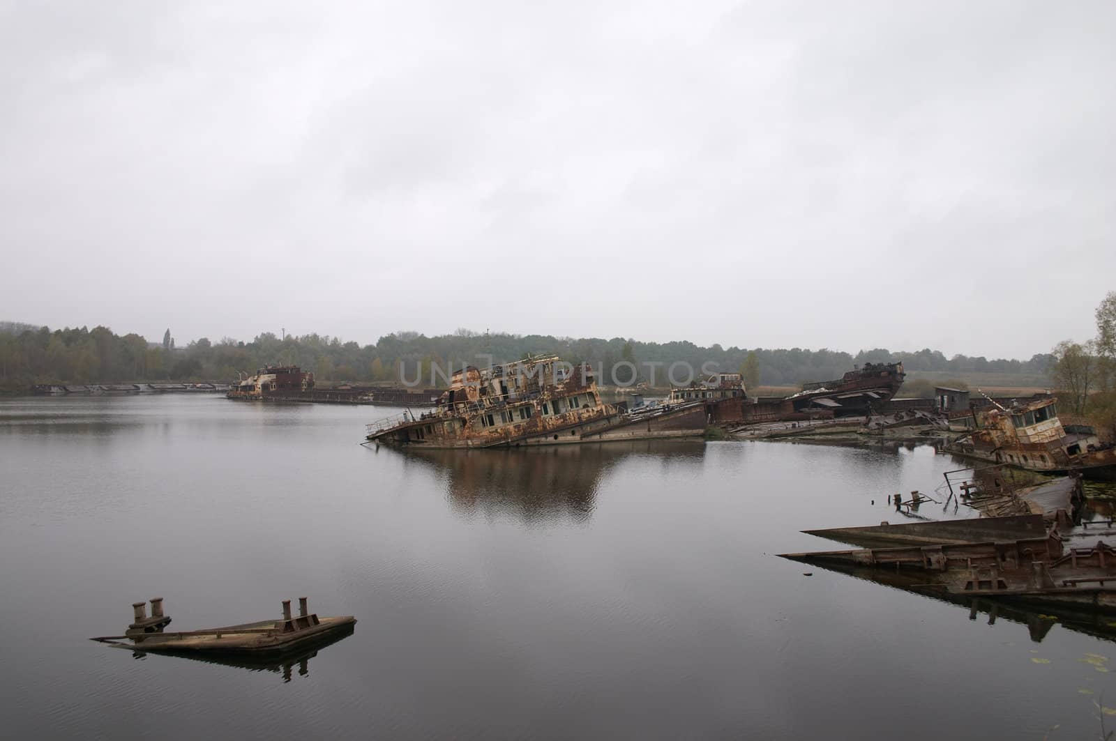 old rusty ships in the river near of Chernobyl
