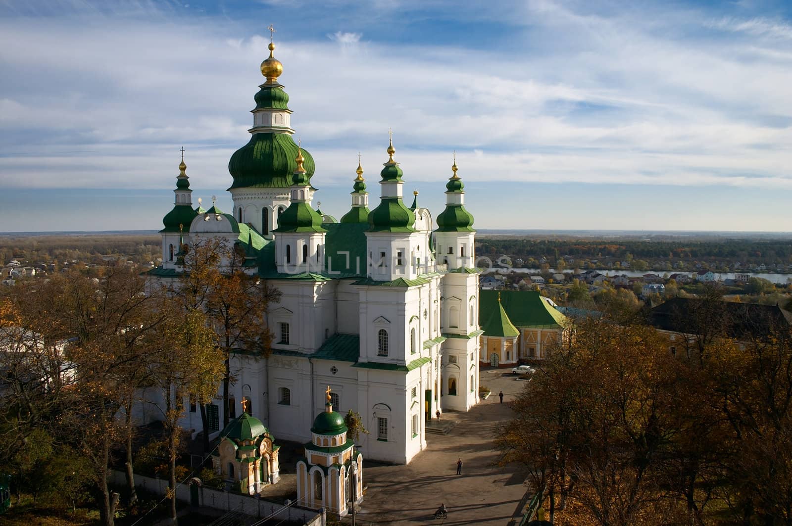 Protestant Christianity cathedral with green cupola under blue sky