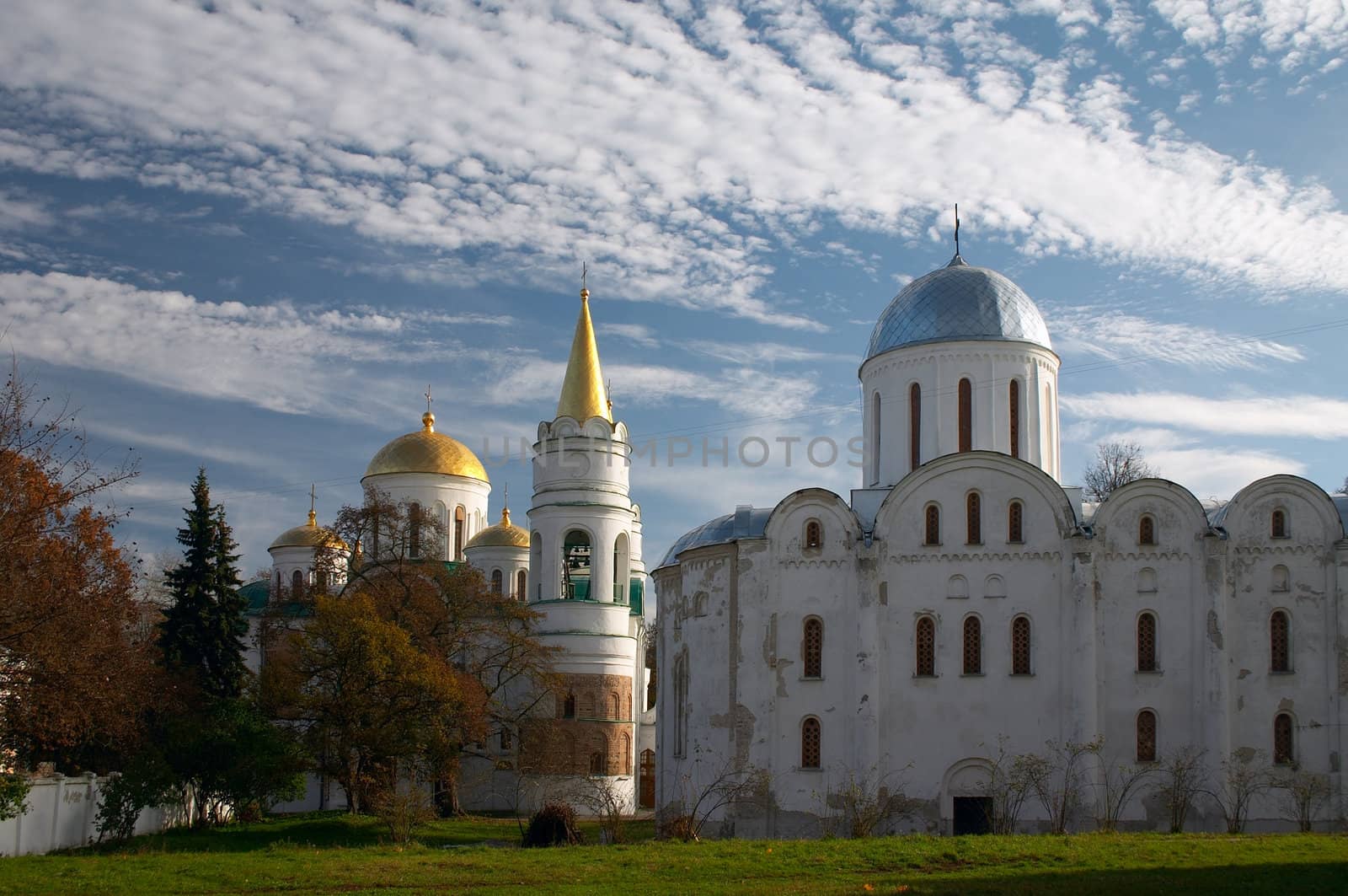 old Christianity churches under blue sky with clouds