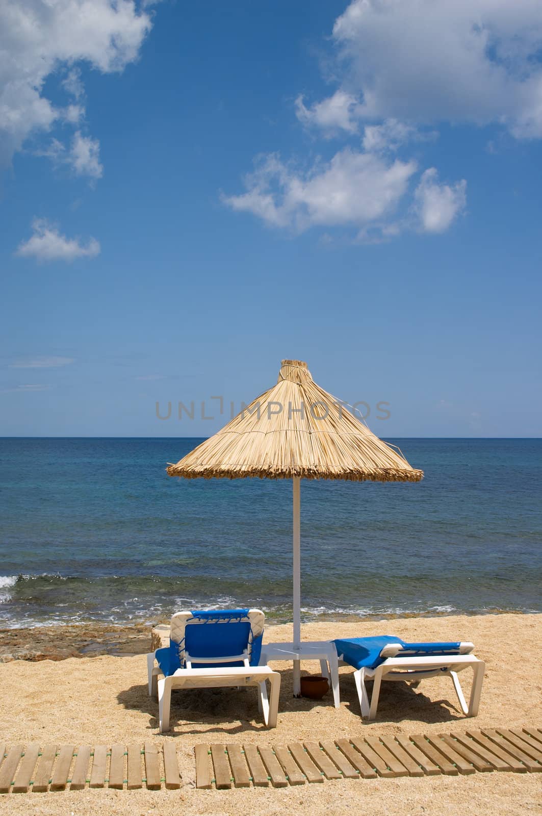 couch and sunshade on the seaside