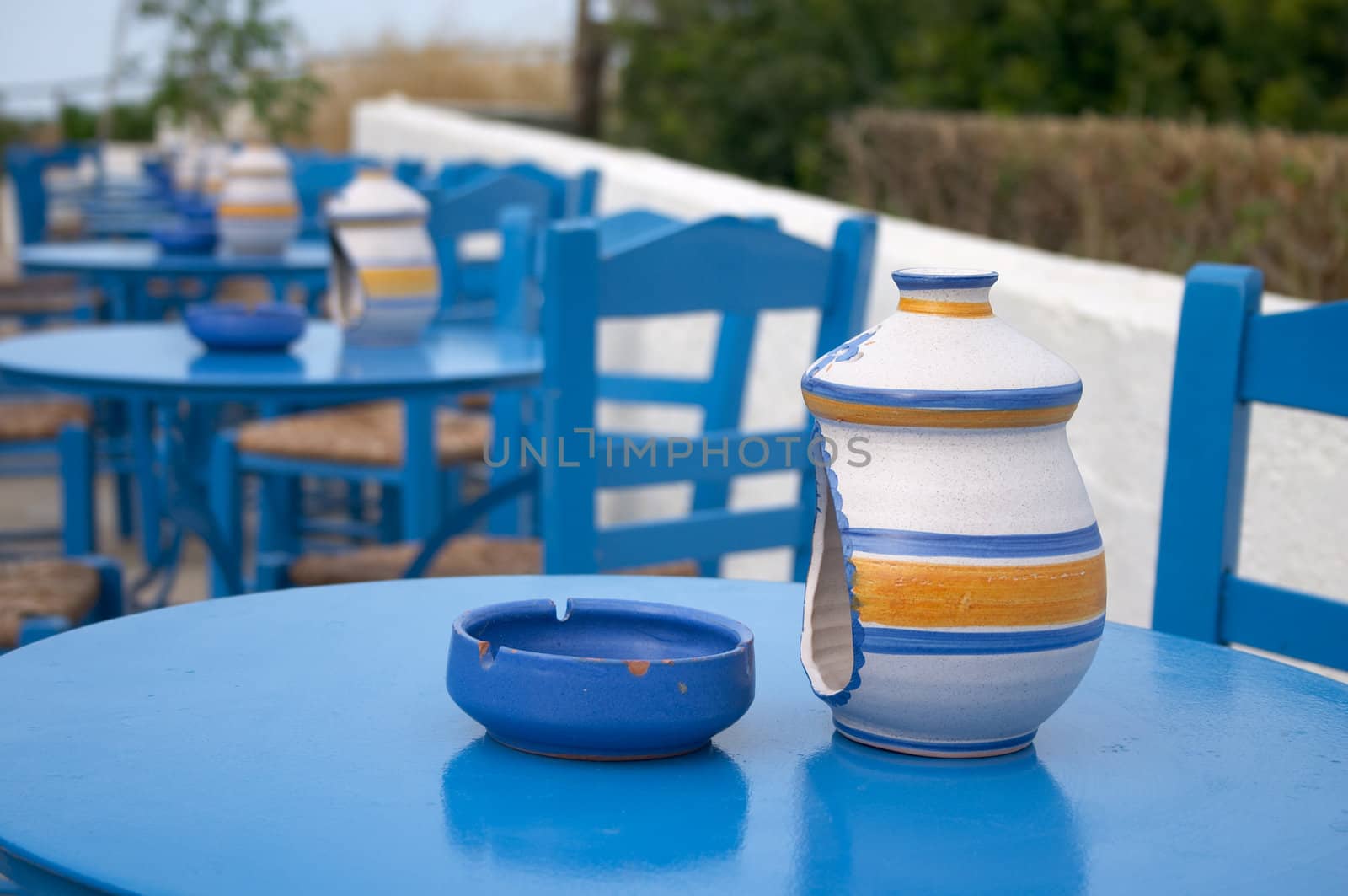 blue tables in cafe with ash tray scone