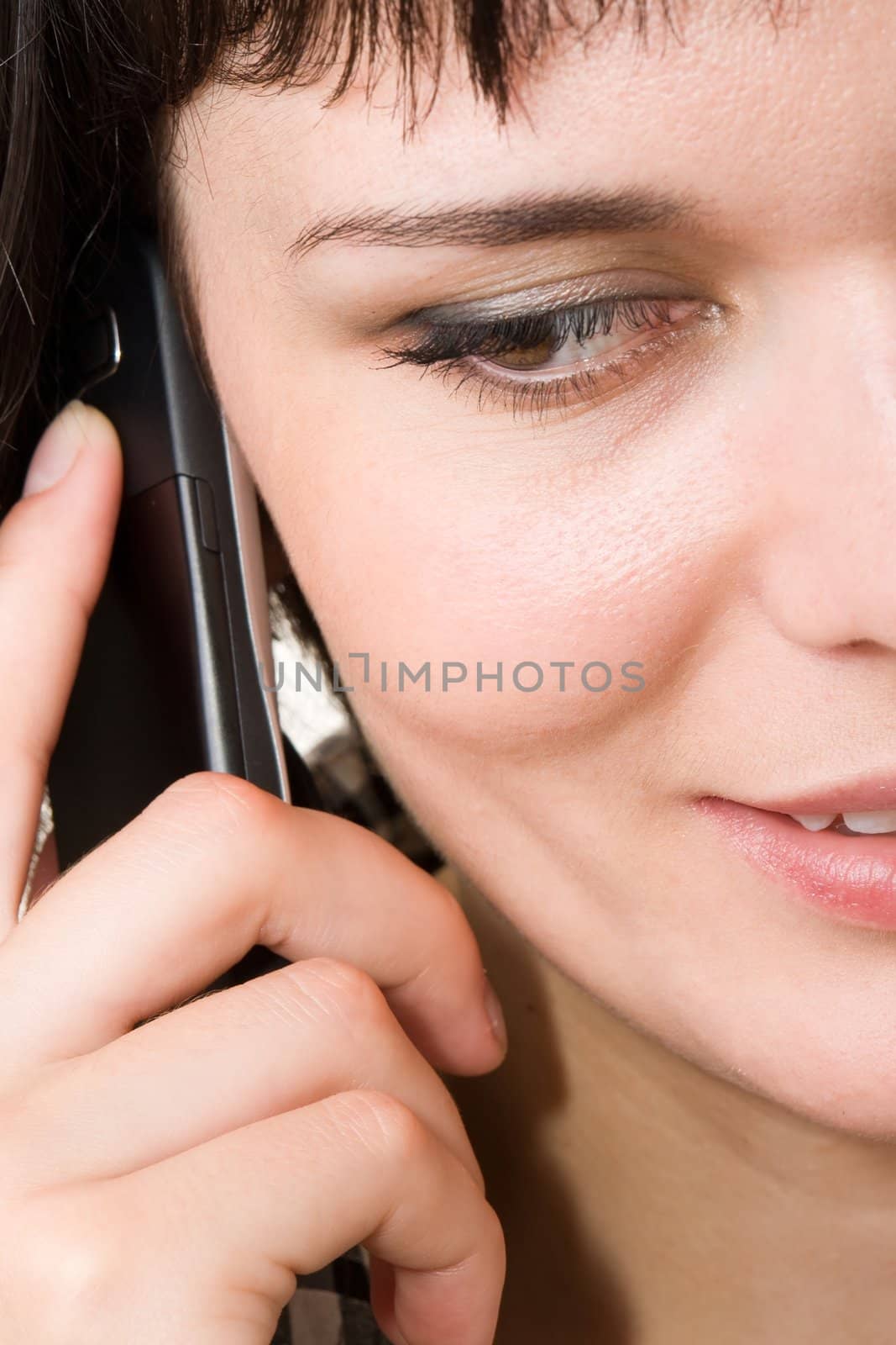 smiling woman with mobile phone close up