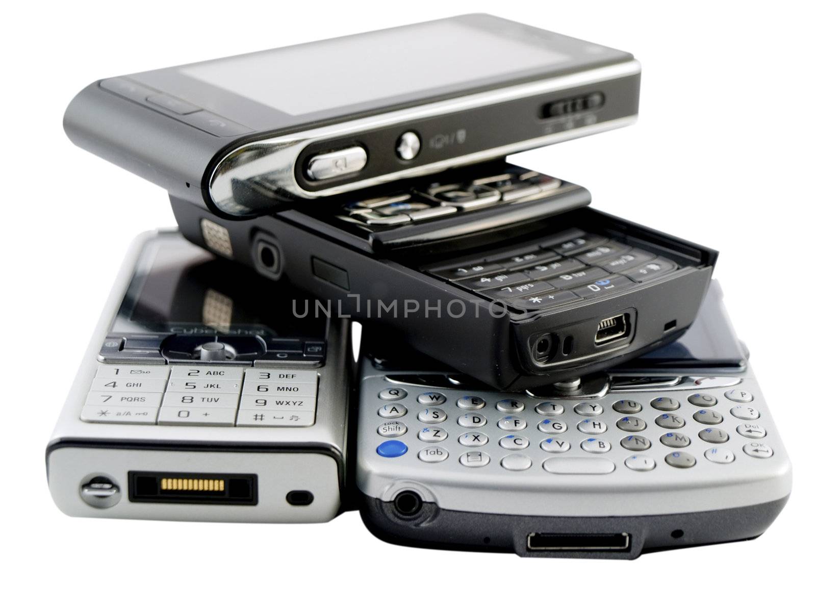 Stack of Several Modern Mobile Phones on White by bobbigmac