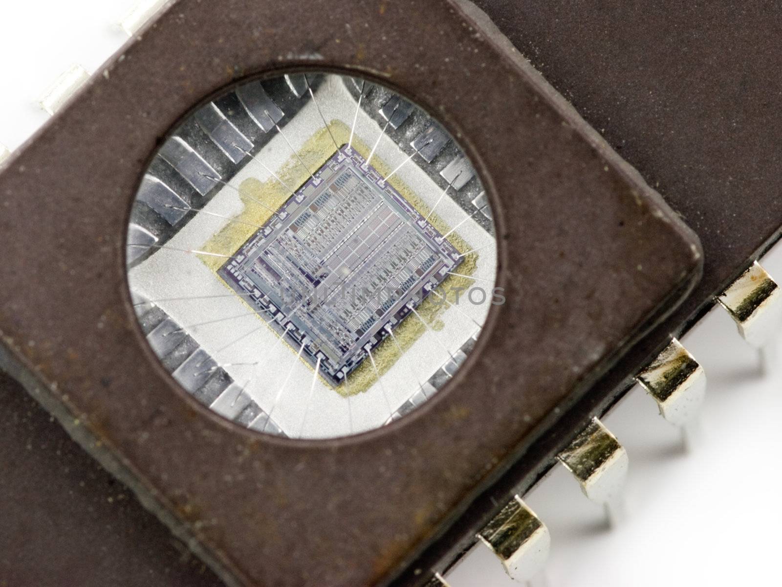 EPROM memory microchip with a transparent window, showing the integrated circuit inside