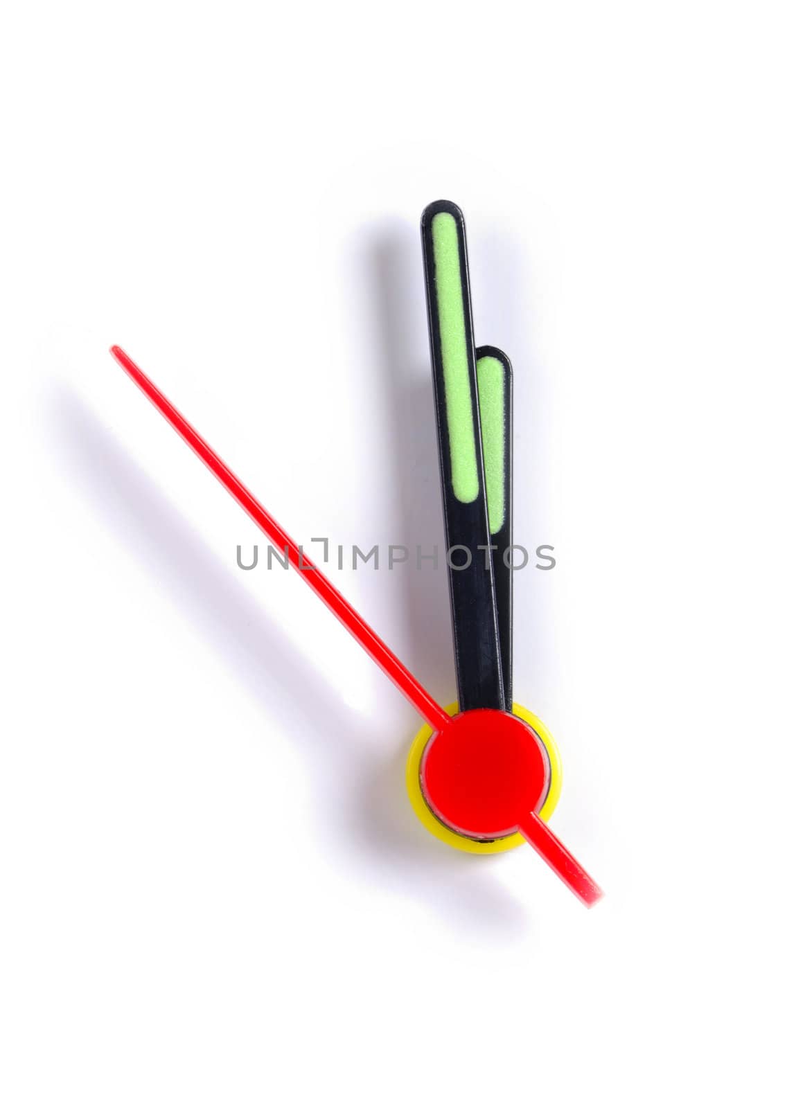 Close up of the hands of a clock, isolated on white, with the time approaching midnight.