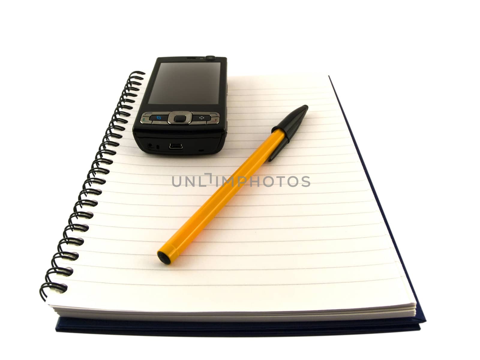 Mobile Phone and Biro Ballpoint Pen on Notepad Isolated over White