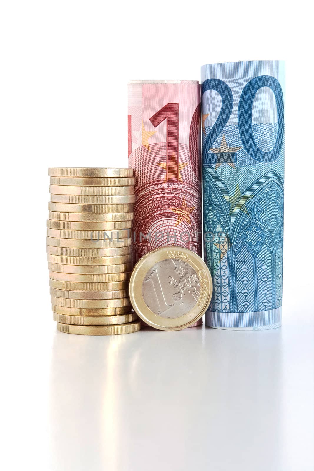 three euro rolled bills with one euro coin isolated on white background
