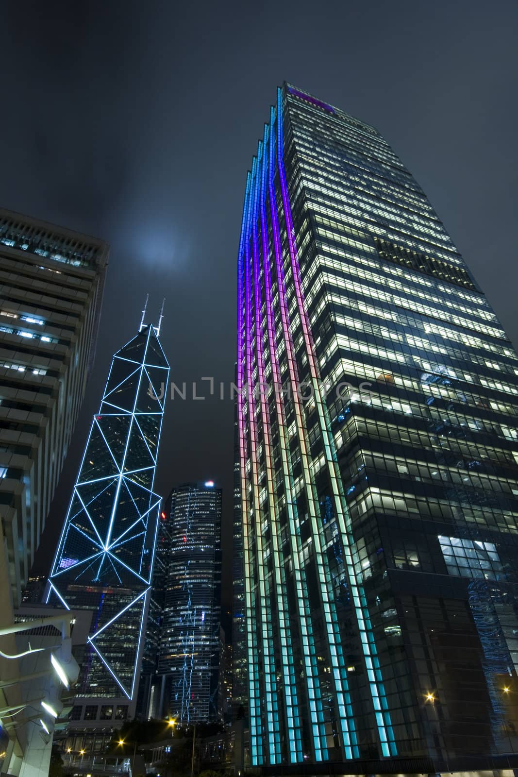 Hong Kong at night with highrise buildingsa