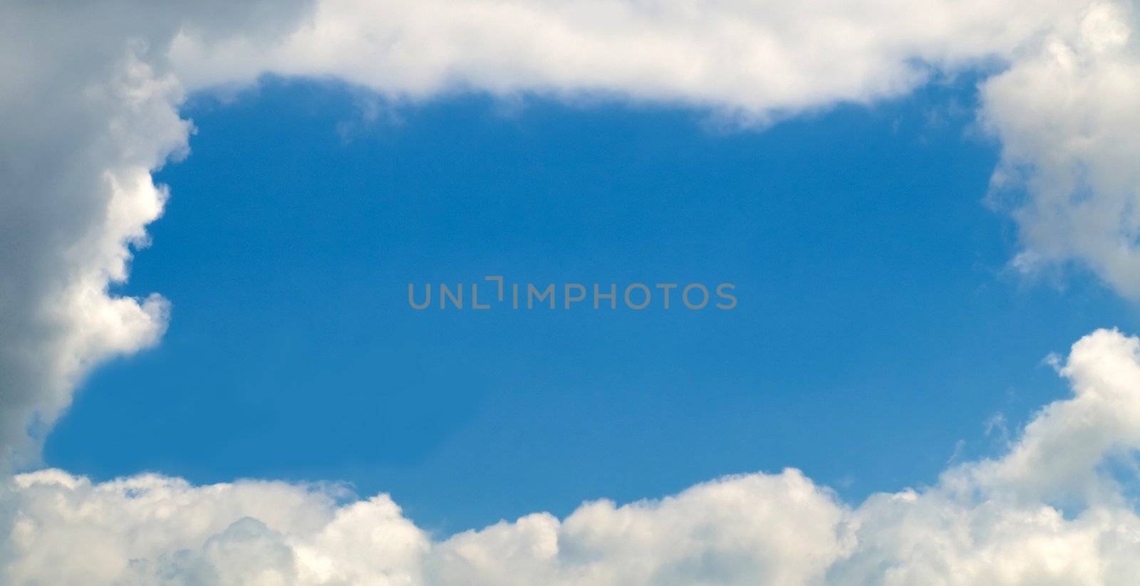 Sky with a nice frame of clouds with large copy space