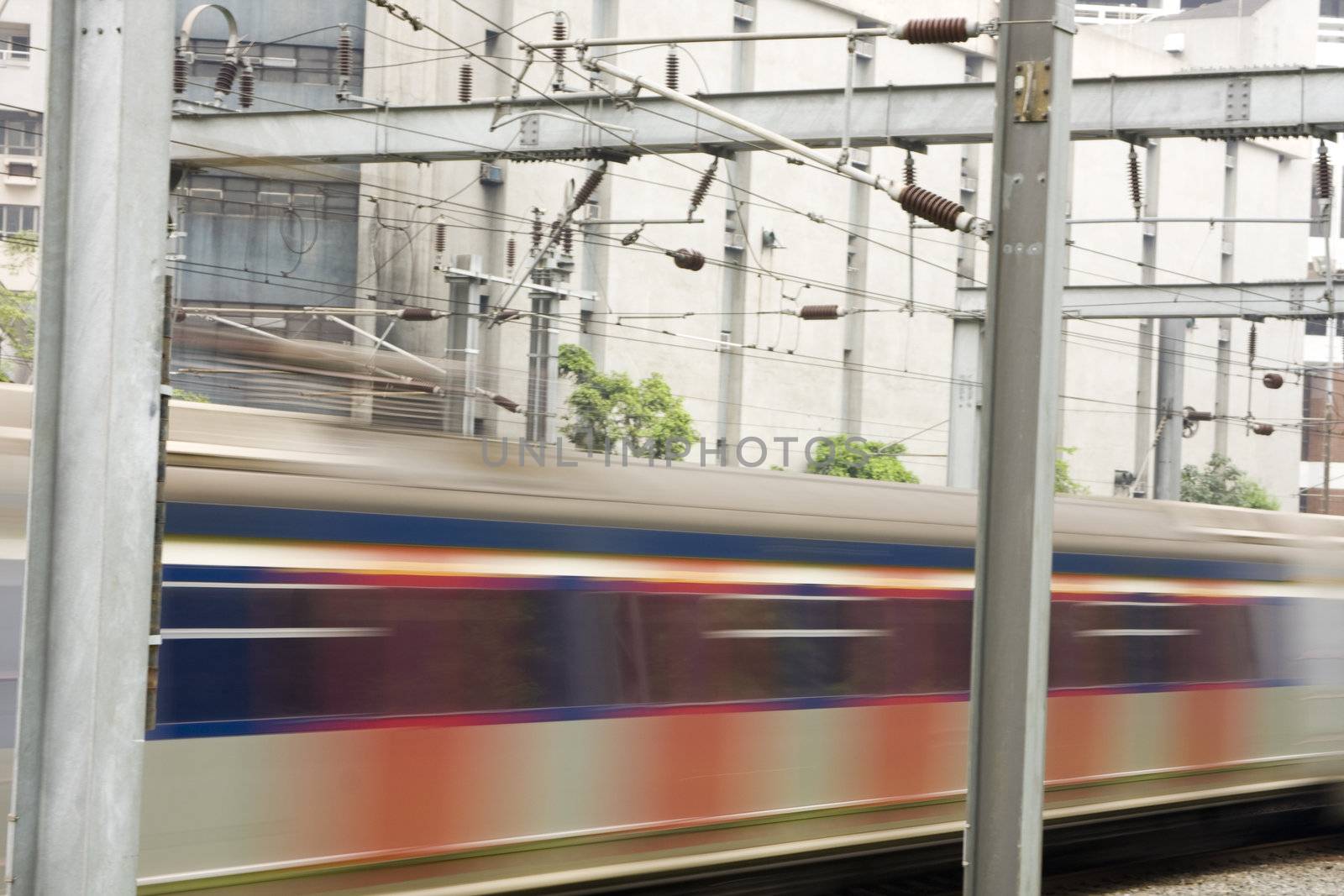 It is a shot of fast train passing the rail