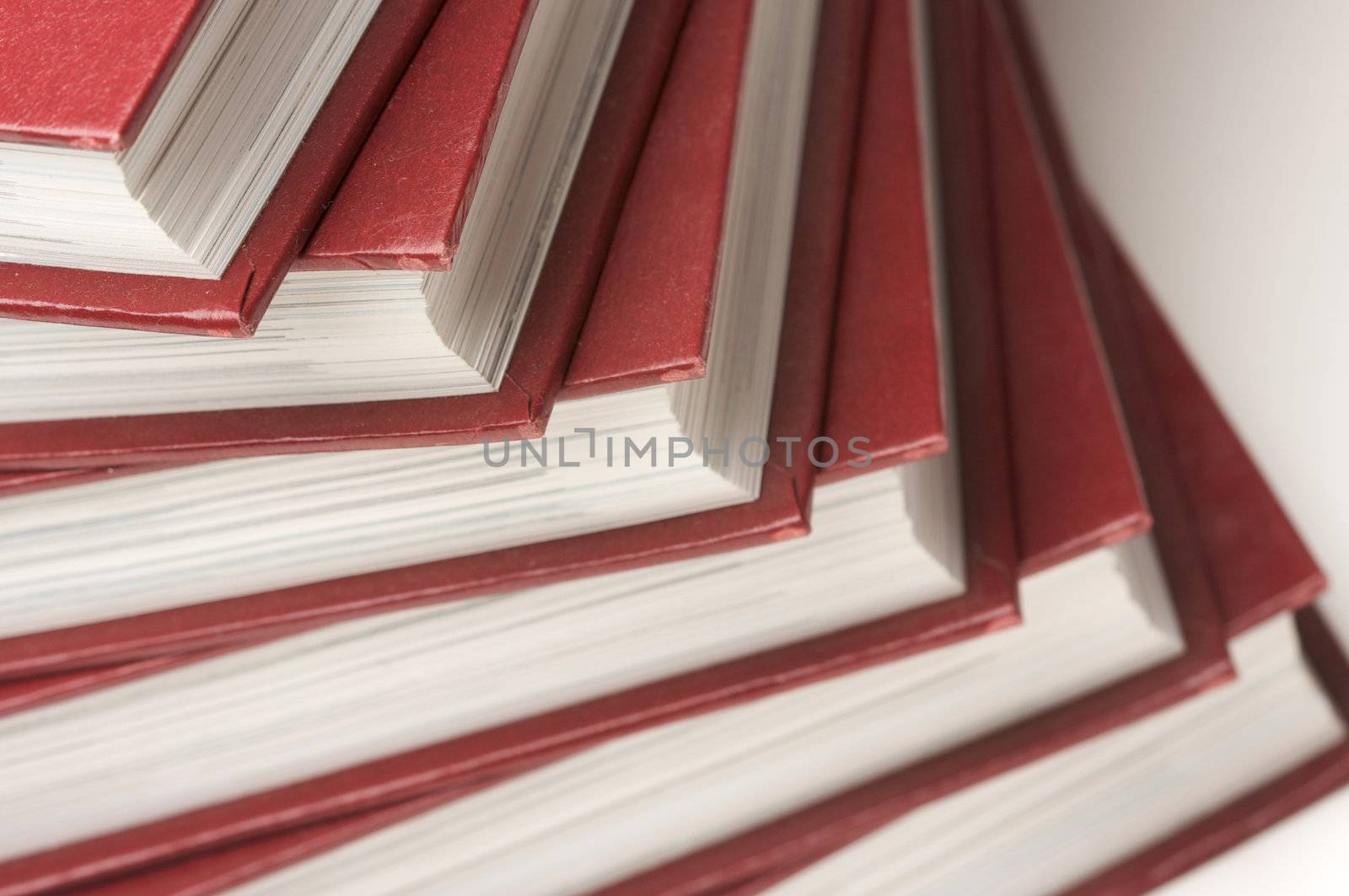 Burgundy Covered Stack of Books Close Up.