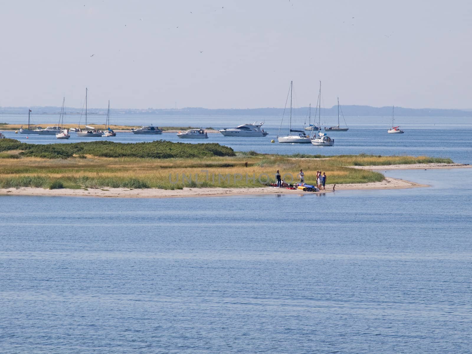 Dream vacation and beach fun - boats anchored on a beautiful beach