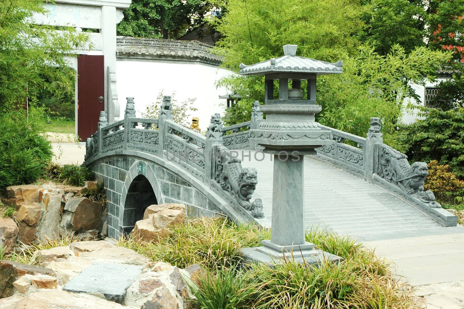 A bridge at Oriental Garden with green surroundings