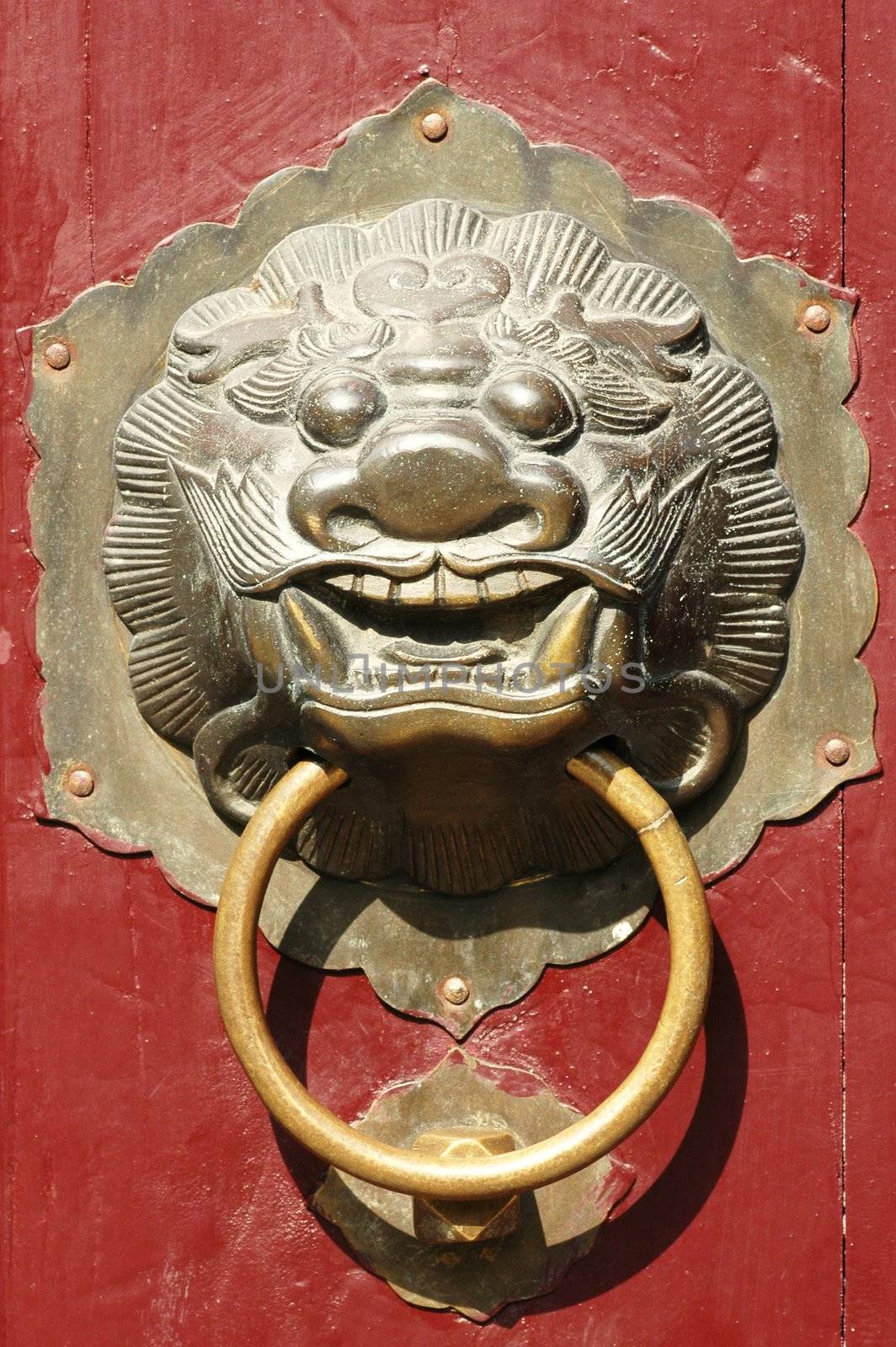 Close up of traditional oriental Chinese lion door knob
