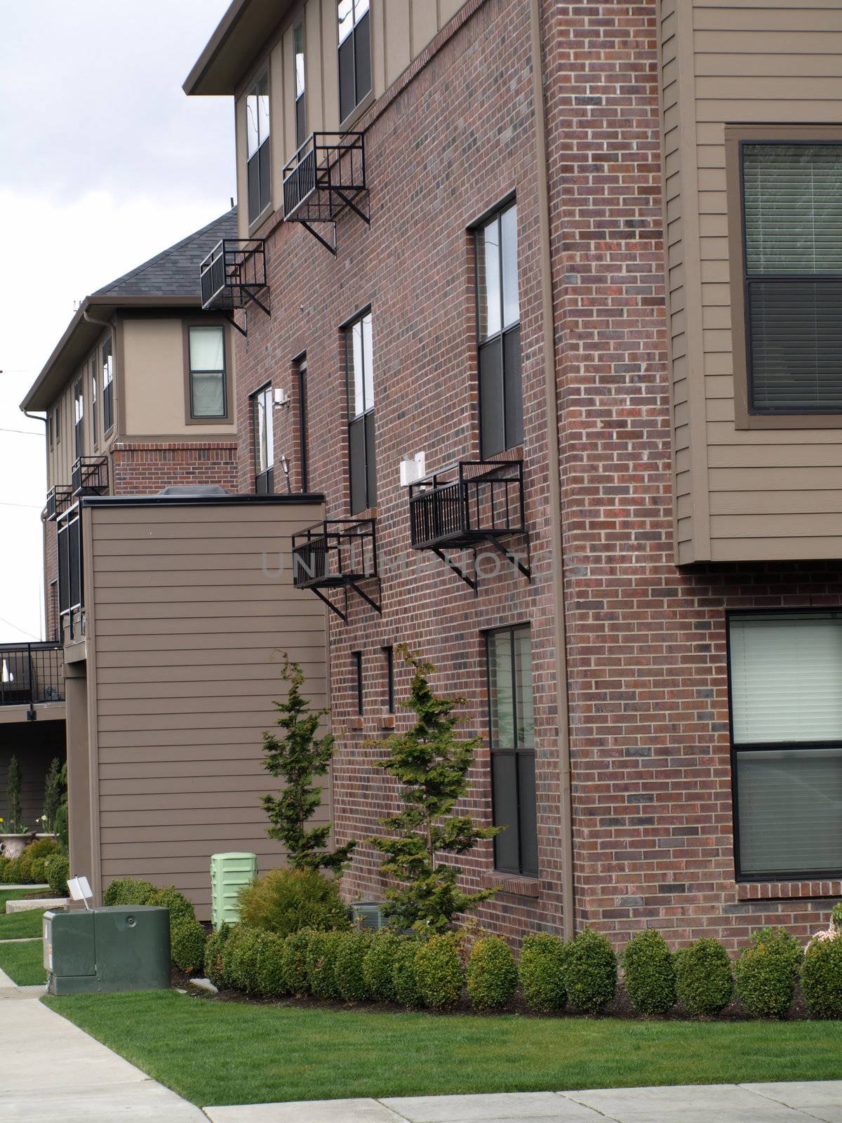 Apartment building with nice green landscaping around it