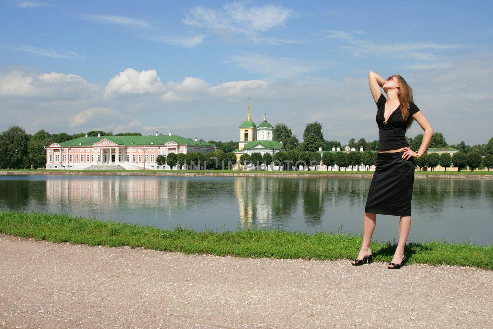 The beautiful woman faces to a beautiful ancient palace