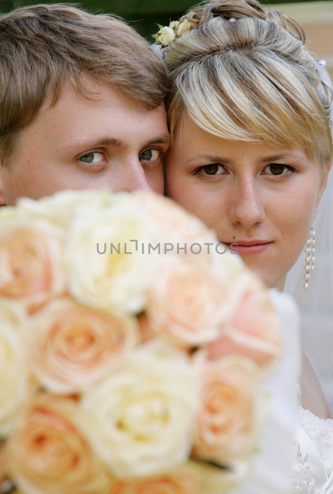 The groom and the bride during walk in park